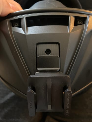 Close-up of a customer's black Shoei RF-SR/RYD Camera Mount attached securely to the chin of a helmet.