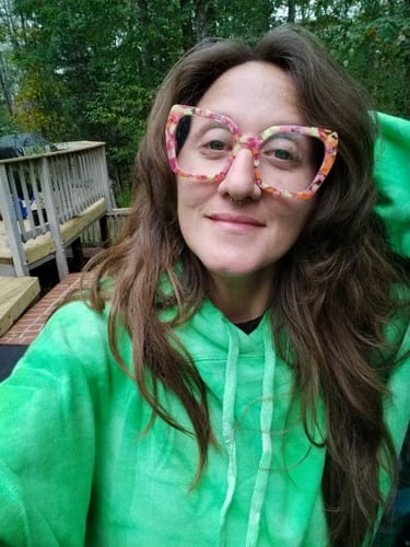 Reviewer showing their long, voluminous hair after using the Rosemary & Biotin Shampoo Bar.