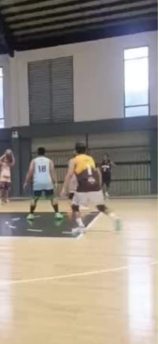 Reviewer playing an indoor basketball game in their adidas Harden Volume 9 Basketball Shoes.