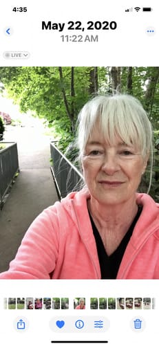 Reviewer, a long-time user of F-Balm, in an outdoor selfie showing her smooth facial skin.