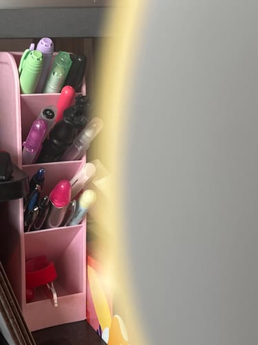 Partial view: Customer's pink Tiered Office Supply Storage Caddy on a desk, filled with colorful pens and markers.