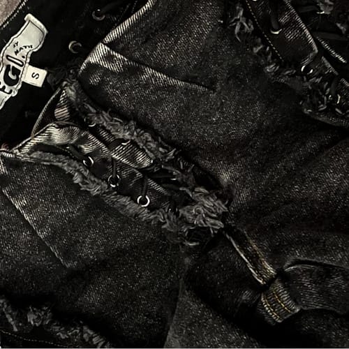 Customer's close-up of the black Villain Moto jacket, focusing on the distressed lace-up back.