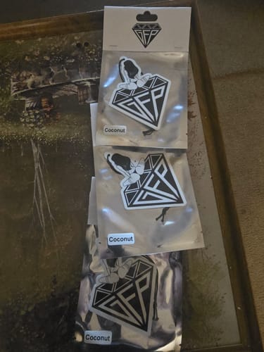 Customer's three Limited Edition Air Fresheners, each in its silver package with a 'Coconut' label.