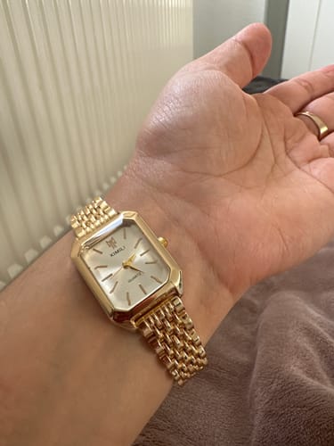 Customer showing their beautiful, gold CLAIRE DE MAINS watch on their wrist.