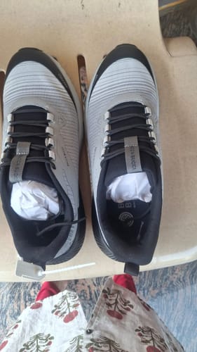 Customer's top-down view of the grey and black Bacca Bucci TrekZON Trekking Shoes placed on a chair.