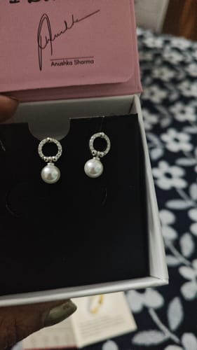 Customer shows the Silver Vibing Pearl Earrings with zircon circles and dangling pearls presented in their open box.