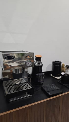 Customer's stainless steel Lelit Anna 2 espresso machine on a dark counter with other coffee accessories.