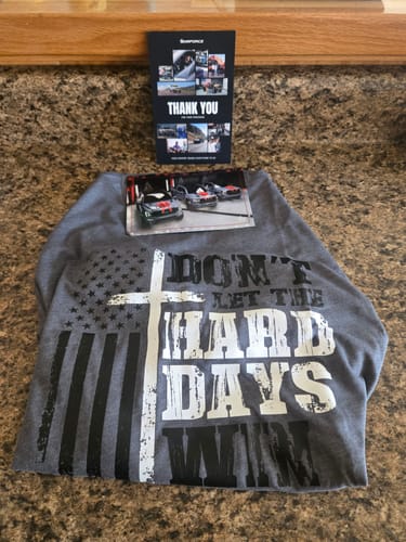 Customer's grey Hard Days Long Sleeve with a graphic print laid out on a countertop.