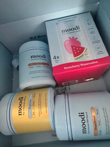 Customer's box of Moodi Strawberry Watermelon Soda 4Pk sitting inside a larger shipping box with other items.