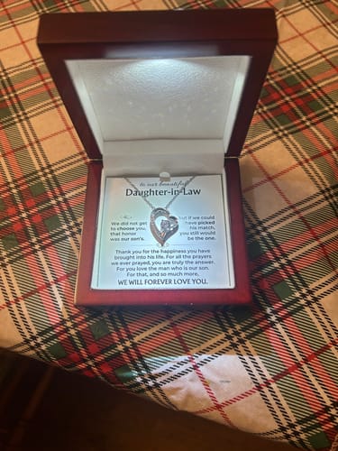 Customer's Forever Love Gift Set in the open mahogany box, with the LED spotlight illuminating the necklace.