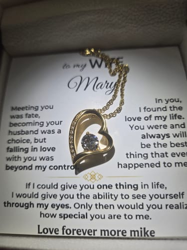 Customer's view of the Forever Love Necklace gift set, showing the gold heart pendant on its personalized message card.