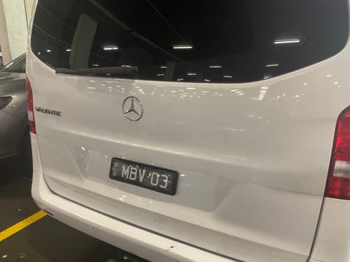 Customer's photo showing the back of a white van.