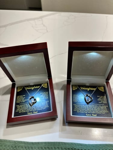 Customer's two 'To My Daughter' gift sets displayed in their open mahogany boxes with the necklaces illuminated by the built-in lights.