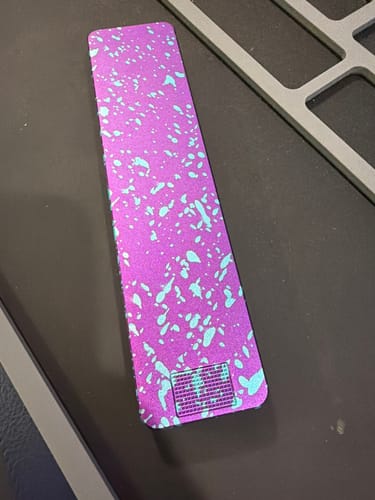 Customer's Weekly Case in a purple color with light blue splatters.