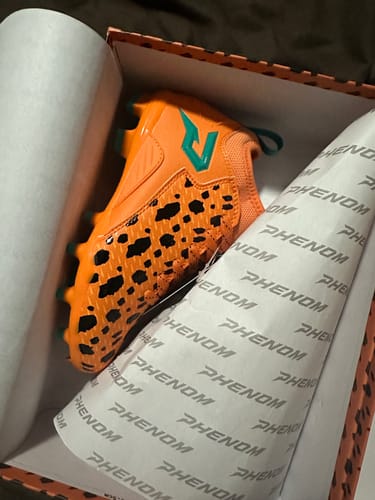 Customer photo review of The Flintstones "Bedrock Blitz" Football Cleats - Quantum Speed by Phenom Elite
