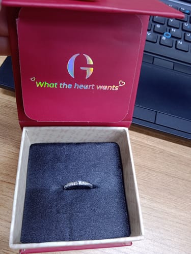 Customer's Silver Deeply in Love Ring displayed inside its open, branded red gift box.