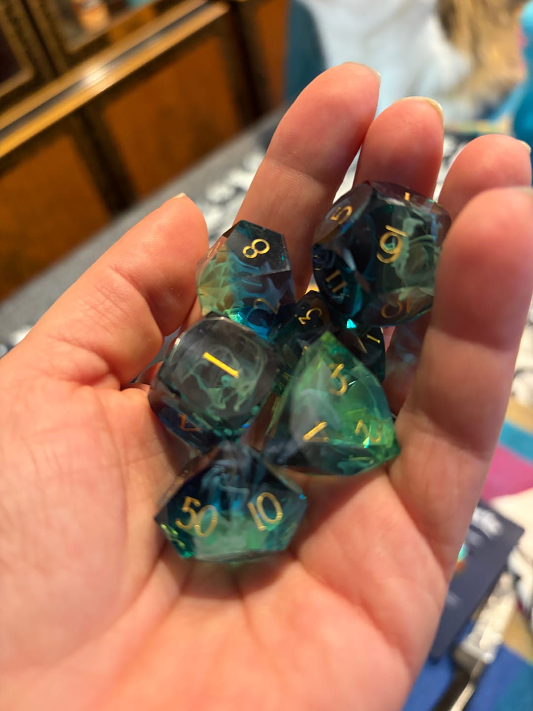 Customer photo review of URWizards D&D Resin Tidebound Fate Engraved Dice Set Multi-faceted Style