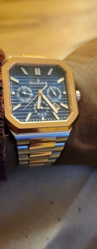 Customer's Oceaneva Tenuis watch on their wrist, showing the blue dial and rose gold case.