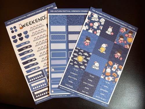 Customer's three blue-themed sticker sheets from the Mid-Autumn Festival Hobonichi Kit, fanned out to show the cute designs.