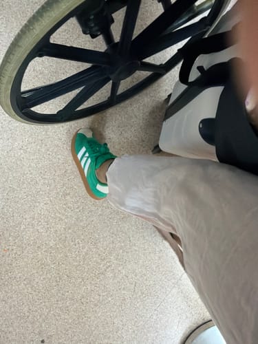 Customer wearing the green and white adidas VL Court 3.0 Casual Shoes, viewed from above.