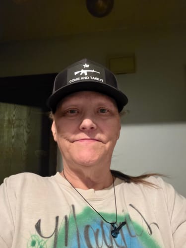 Customer wearing their black Come and Take It Snapback hat.