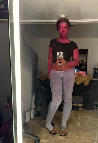 Reviewer takes a mirror selfie to show the fit of the grey Seamless LowRise Leggings.
