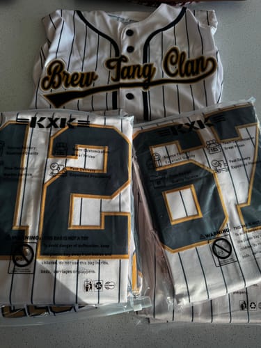 Customer's custom pinstripe baseball jerseys, showing the front of one and the backs of two packaged jerseys.