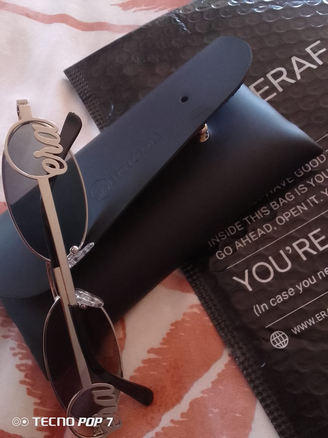 Customer photo review of Muse Logo Sunglasses – Silver Edition