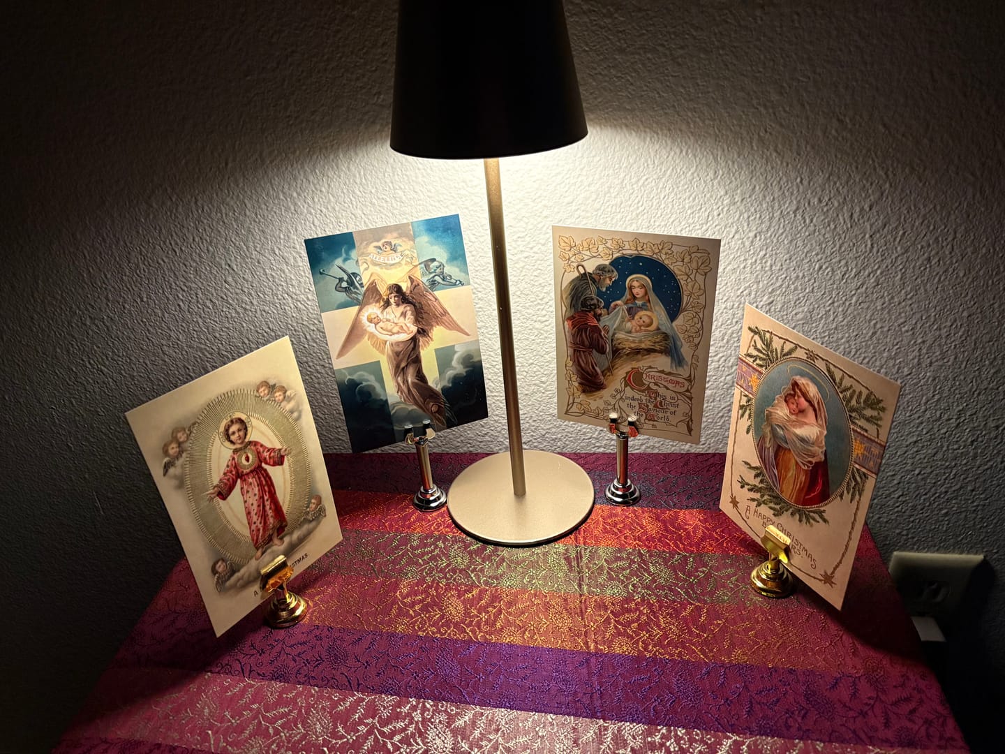 Customer photo review of Holy Card Stand – Stand Only – (Holy Card Not Included) – Brass-Colored Steel Stand to Display Holy Card