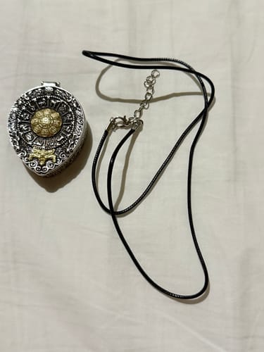 Customer photo review of Tibetan Manifestation Ghau Amulet