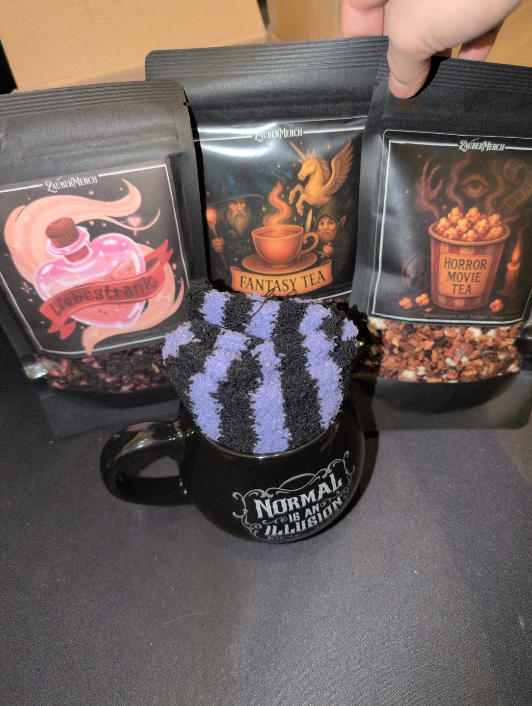 Customer photo review of Normal is an Illusion Tasse mit gestreiften Socken – Geschenkset