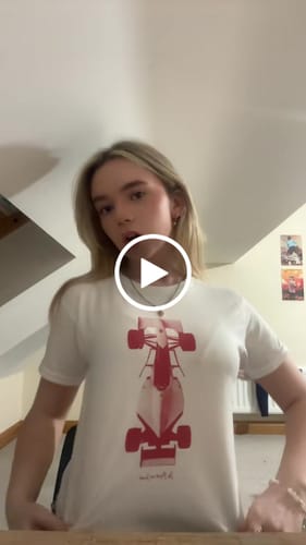 Customer video review of racing car baby tee