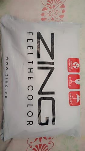 Customer's packaging for the OUD Supreme BUNDLE, showing a white 'ZING' branded mailer bag.