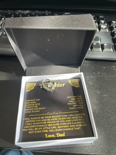Customer's 'To My Daughter' gift set in its open presentation box, with the heart necklace resting on the message card.