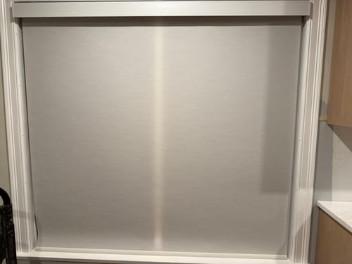 Customer photo review of SmartWings Motorized Light Filtering Roller Shades 70% Blackout Safari