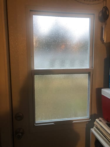 Customer's Venting 1 Lite Glass and Frame Kit installed on a door inside their laundry room.