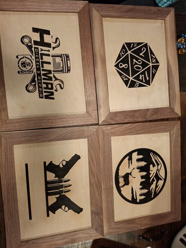 Reviewer's four framed wood art pieces with sharp, clean lines created using the Wood Pre-Treatment.