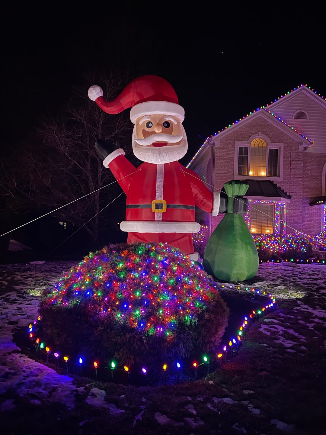 Customer photo review of Giant Inflatable Santa Christmas Outdoor Decor with Green Gift Bag 20/26/33/40ft