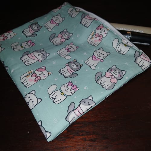 Customer's finished makeup bag made with the pretty Kitty Squad Cotton Poplin Fabric, showing the cat pattern.