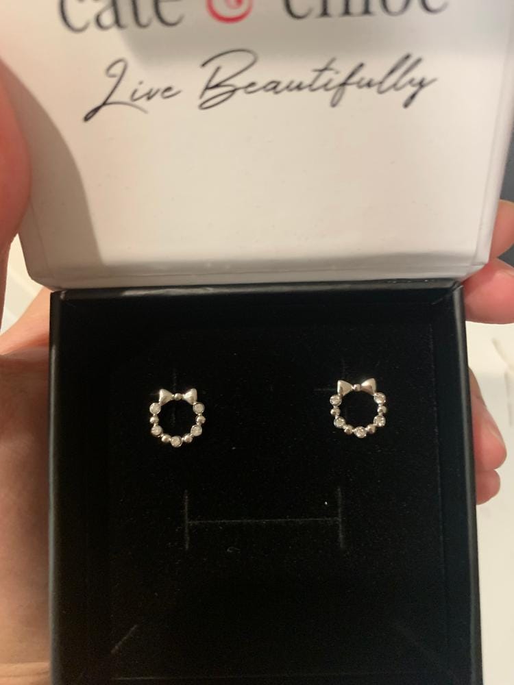 Customer photo review of Edith 18k White Gold Plated Silver Ribbon Stud Earrings with Swarovski Crystals