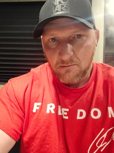 Customer photo review of FREE Murdered Out Infowars Trucker Hat