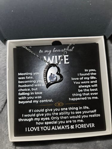 Customer's 'To My Wife' gift set showing the heart necklace in its display box on a grey surface.