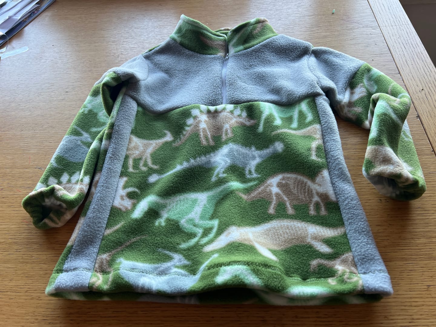 Customer photo review of Dino Skeletons on Green Anti Pill Polar Fleece Fabric