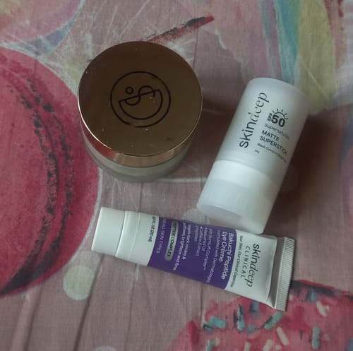 Customer's Bakuchi Peptide Eye Crème tube shown with a Skindeep sunblock stick and another product.
