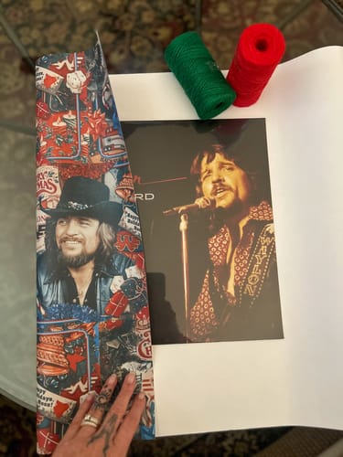 Customer photo review of Waylon Jennings Christmas Wrapping Paper Sheets