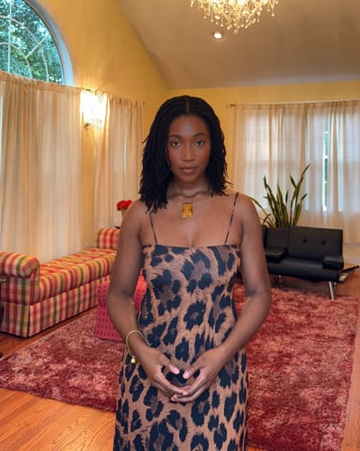Customer's front view of the Naked Print A-Line Maxi Dress, showing the neckline and print.