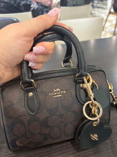 Customer photo review of Boxed Mini Rowan Crossbody Bag And Mirror Bag Charm Set In Signature Canvas (Gold/Walnut/Black) - Disponivel em Portugal