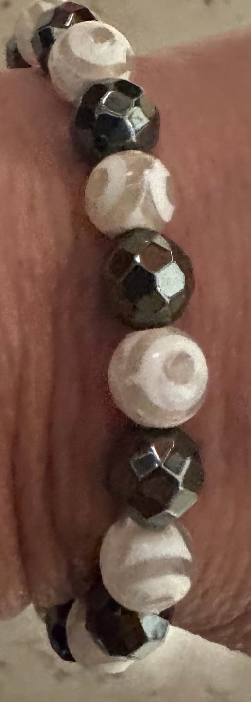 Customer photo review of Faceted Black Hematite and White Etched Tibetan Dzi Agate Stretch Bracelet  – Artisan Made
