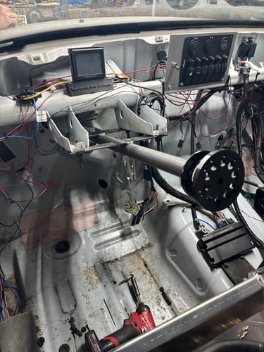 Customer's custom-installed DIY Chromoly Steering Column Kit in the bare interior of their drag truck.