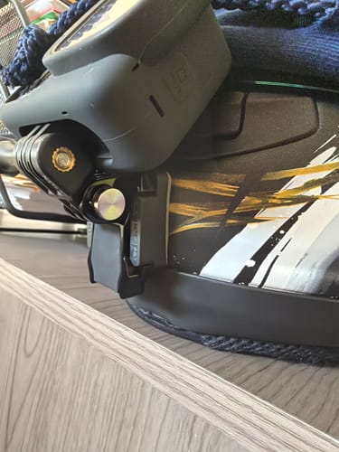Customer's close-up view of the black camera mount fitted securely to an Arai helmet with an action camera.